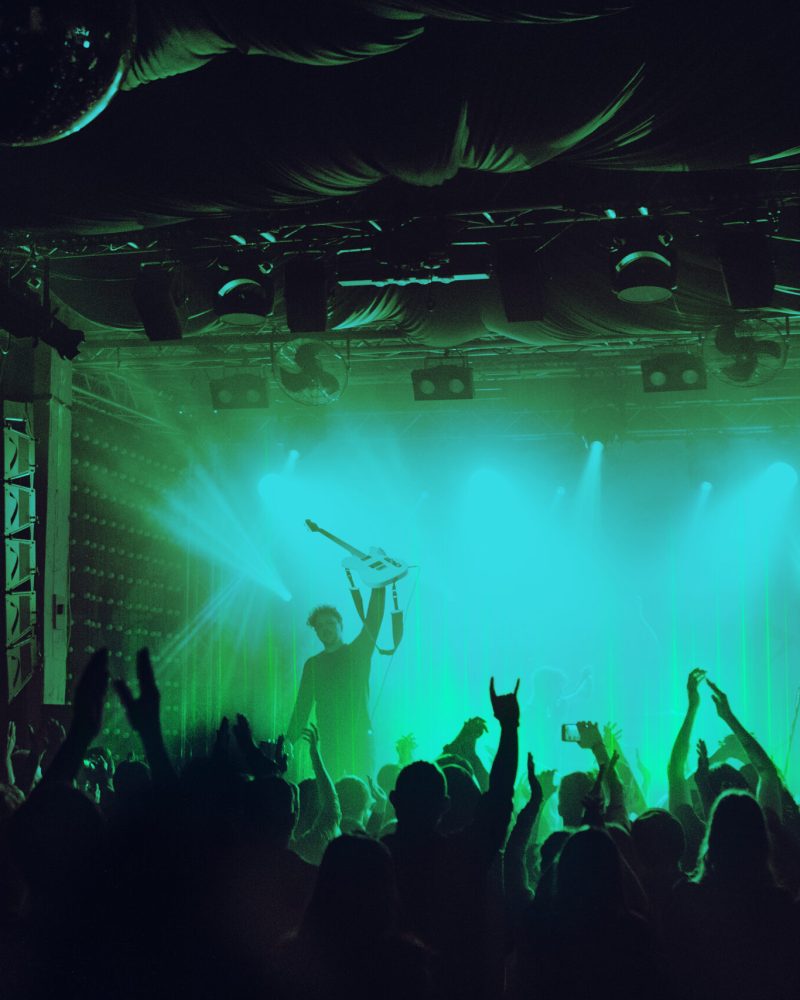 Sound wave technology cheering crowd at concert remixed media